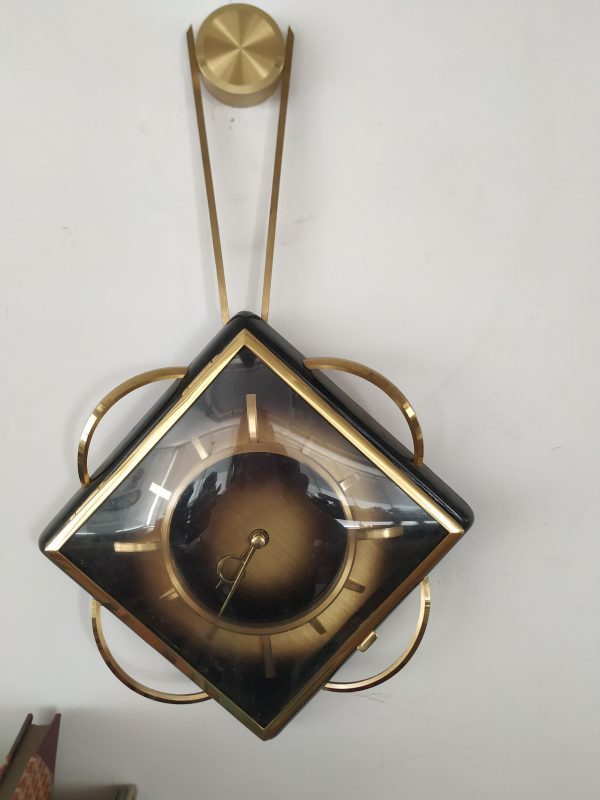 Orologio da parete meccanico nero e dorato