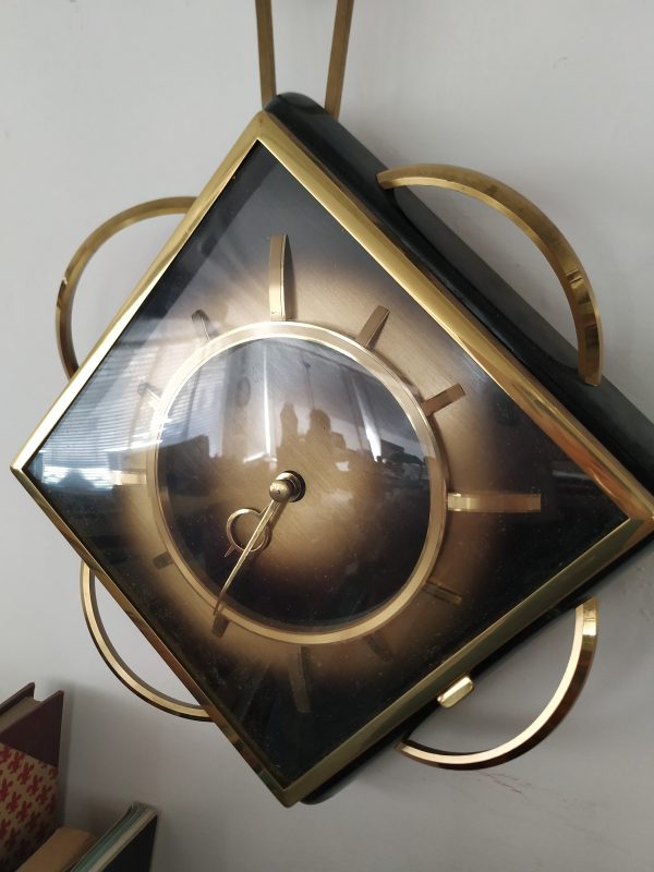 Orologio da parete meccanico nero e dorato - immagine 2